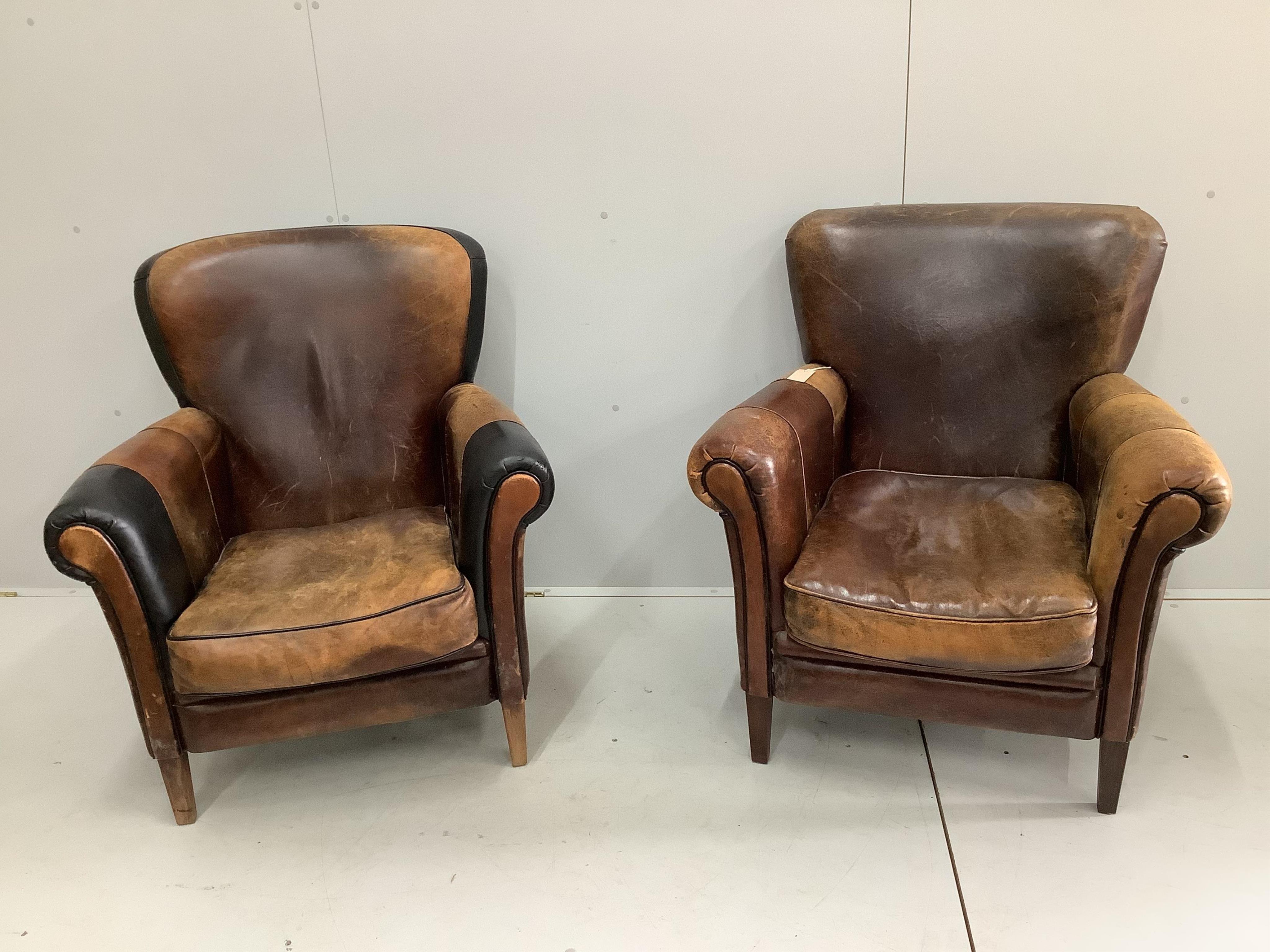 A leather settee, width 156cm, depth 78cm, height 82cm and a pair of leather wing armchairs. Condition - fair